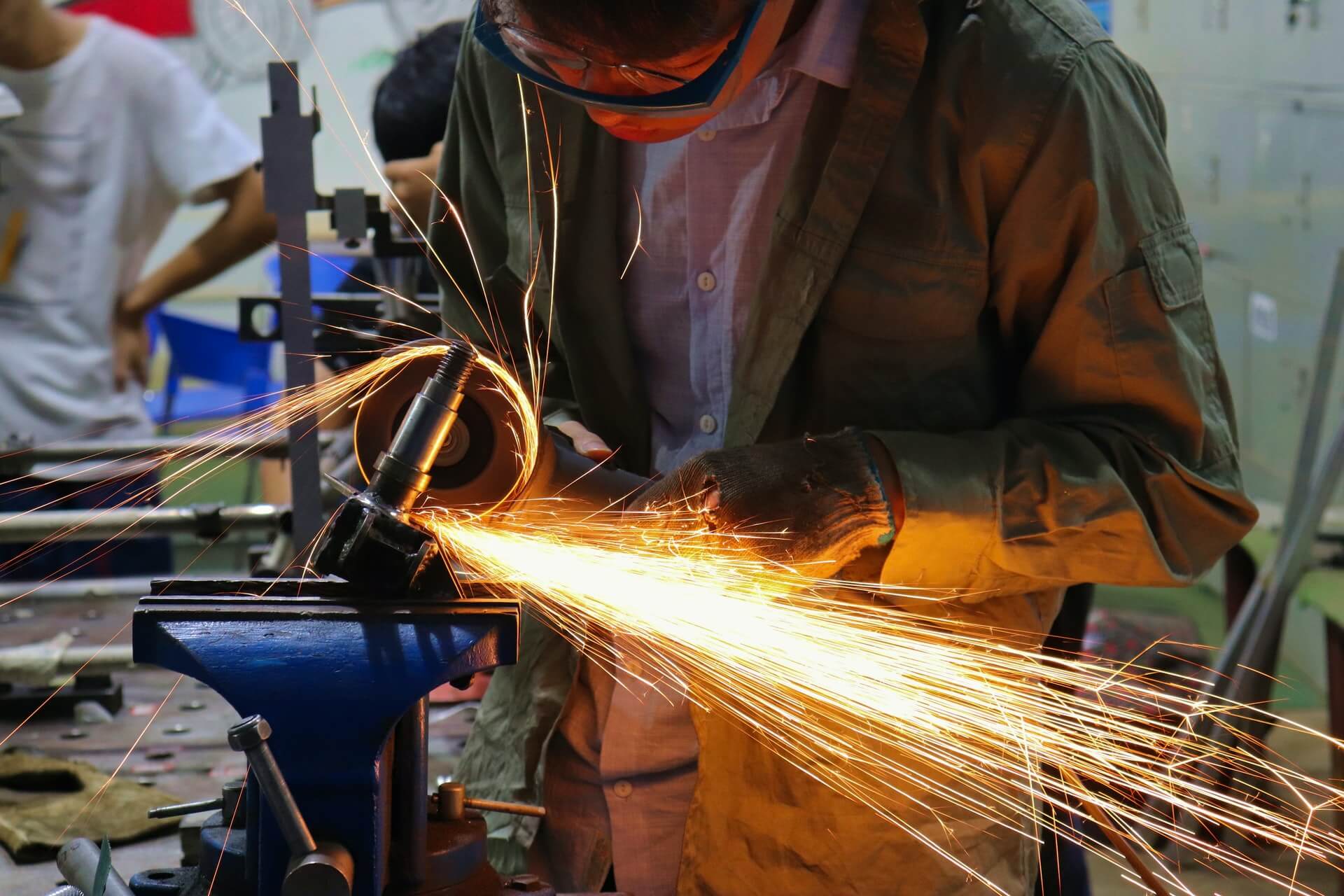 worker cuts down steel